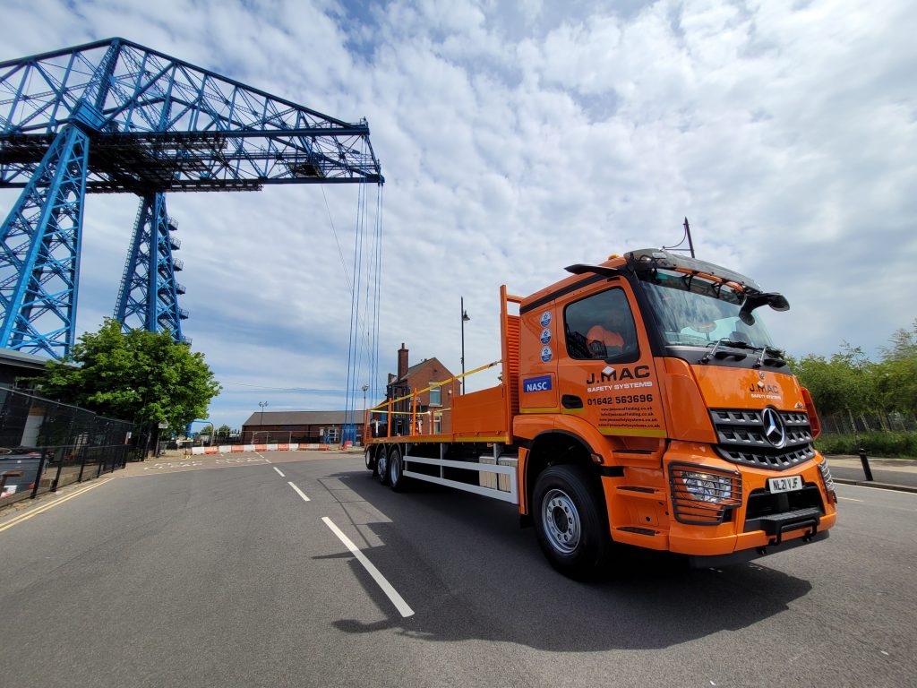 JMAC Mercedes truck with Transporter Bridge in the background